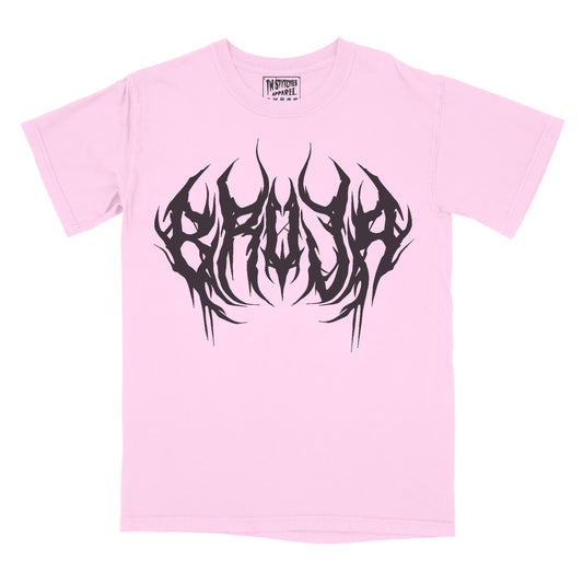 Pink graphic tee with 'Bruja' text in a stylized font and a graphic design in black.