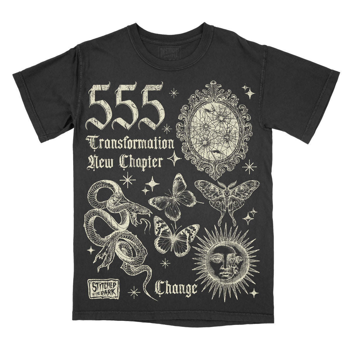 black T-shirt featuring a distressed 555 angel number design with a cracked mirror, snakes, butterflies, moth, and celestial sun, with text reading “Transformation,” “New Chapter,” and “Change,” plus Stitched in the Dark branding.