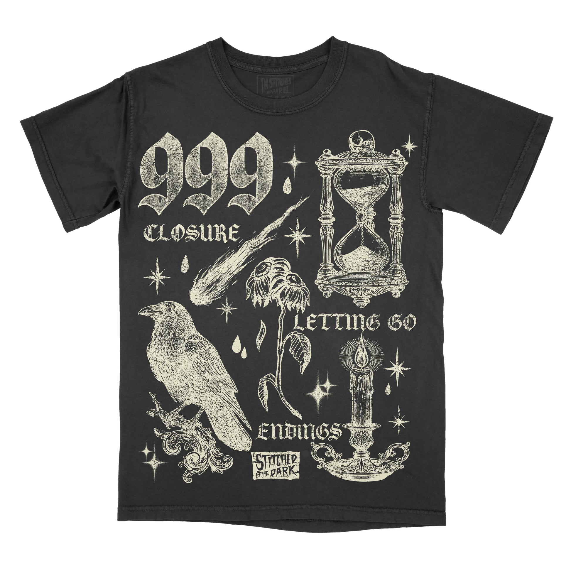 black T-shirt featuring a distressed 999 angel number design with an hourglass, raven, wilted flower, candle, and celestial stars, with text reading “Closure,” “Letting Go,” and “Endings,” plus Stitched in the Dark branding.