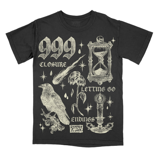 black T-shirt featuring a distressed 999 angel number design with an hourglass, raven, wilted flower, candle, and celestial stars, with text reading “Closure,” “Letting Go,” and “Endings,” plus Stitched in the Dark branding.