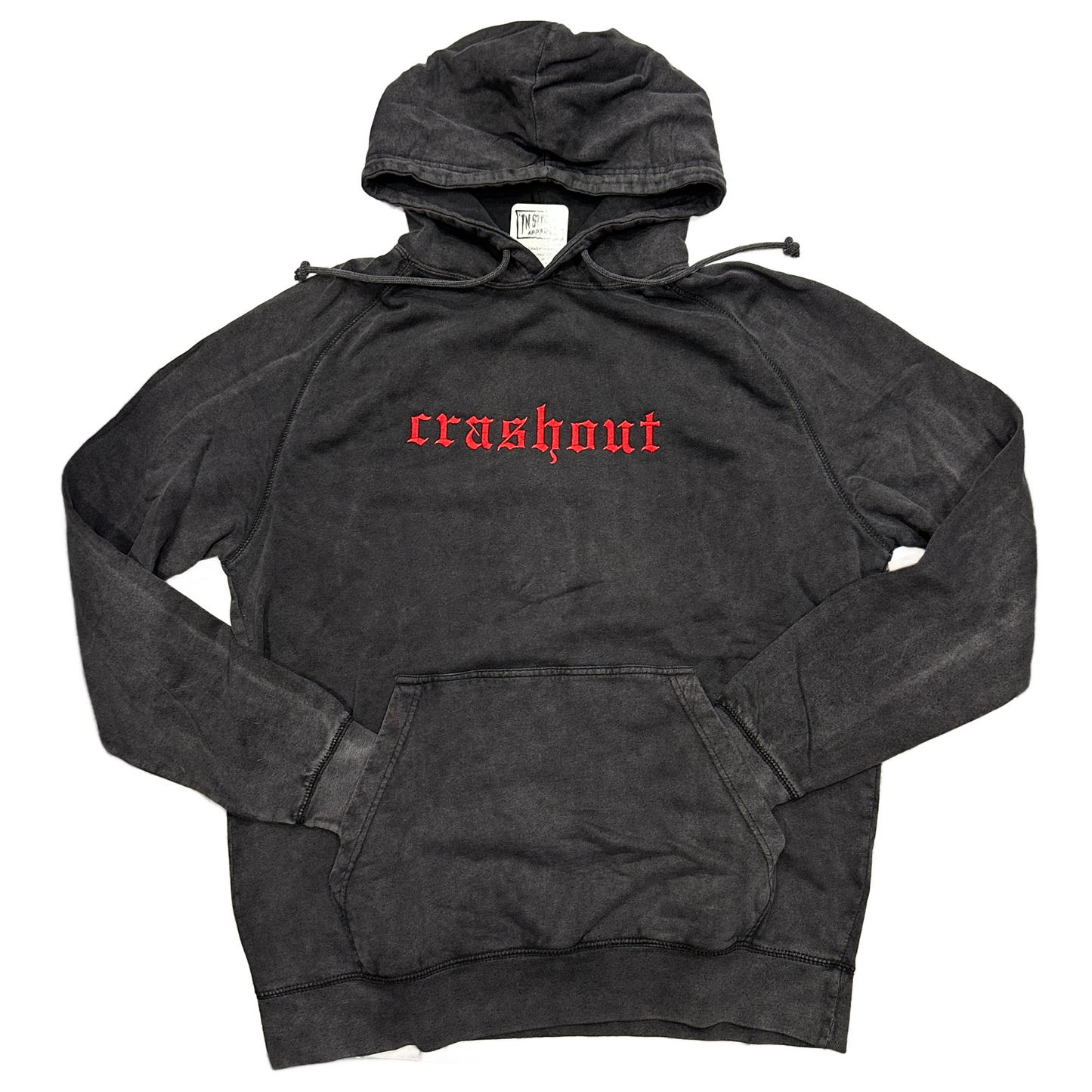 A washed black pullover hoodie with the word 'crashout' embroidered in red gothic font across the chest, laid flat on a white background.