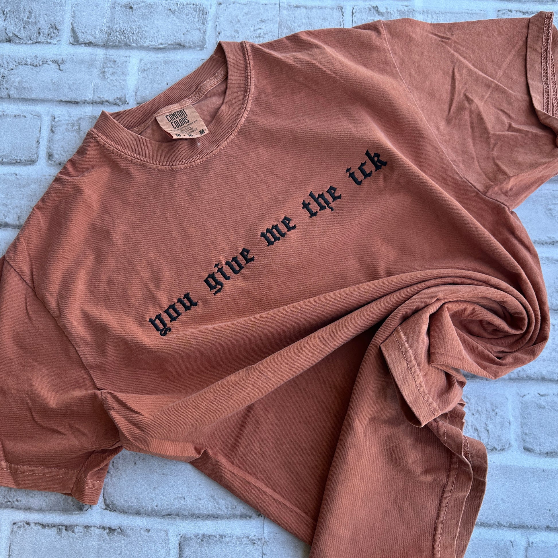 Yam Comfort Colors T-shirt featuring black embroidered Old English text across the chest that reads “you give me the ick.”