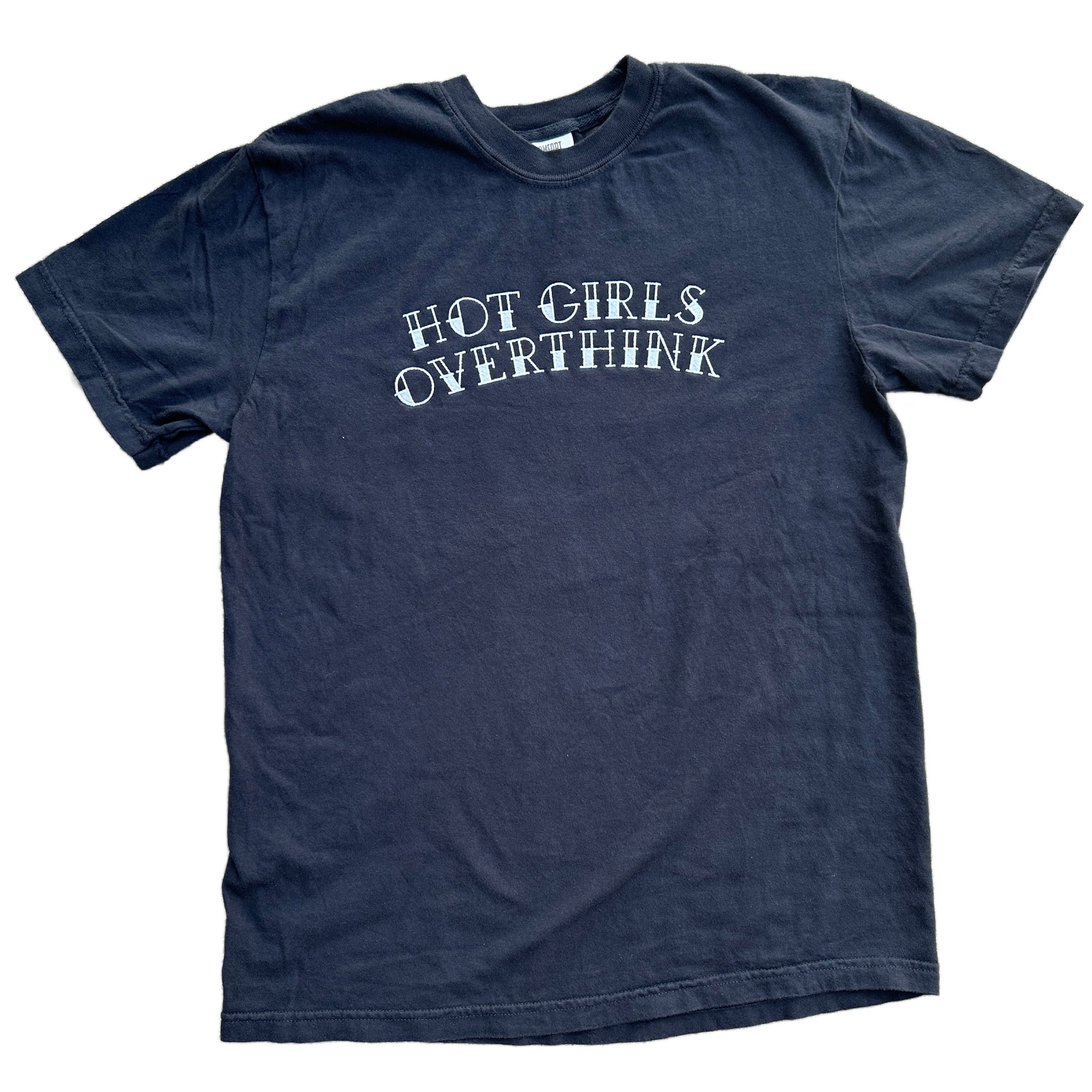 A black short-sleeve t-shirt with the phrase 'HOT GIRLS OVERTHINK' embroidered in a white, stylized font across the chest, displayed flat against a white background.