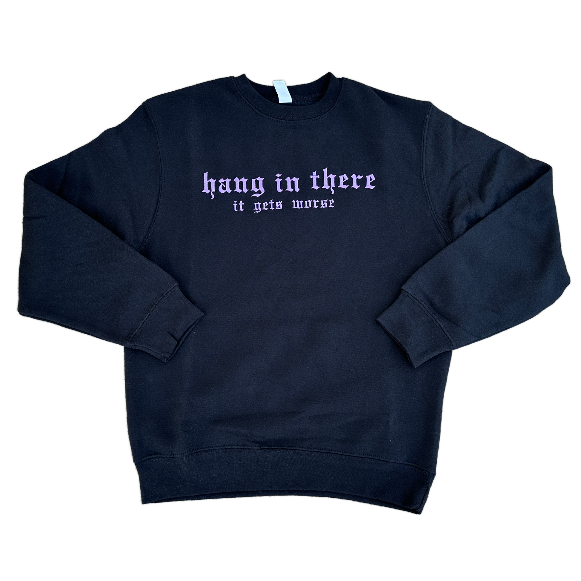 Black crewneck sweatshirt featuring lavender embroidered Gothic text that reads “hang in there” with “it gets worse” underneath, shown on a white background.