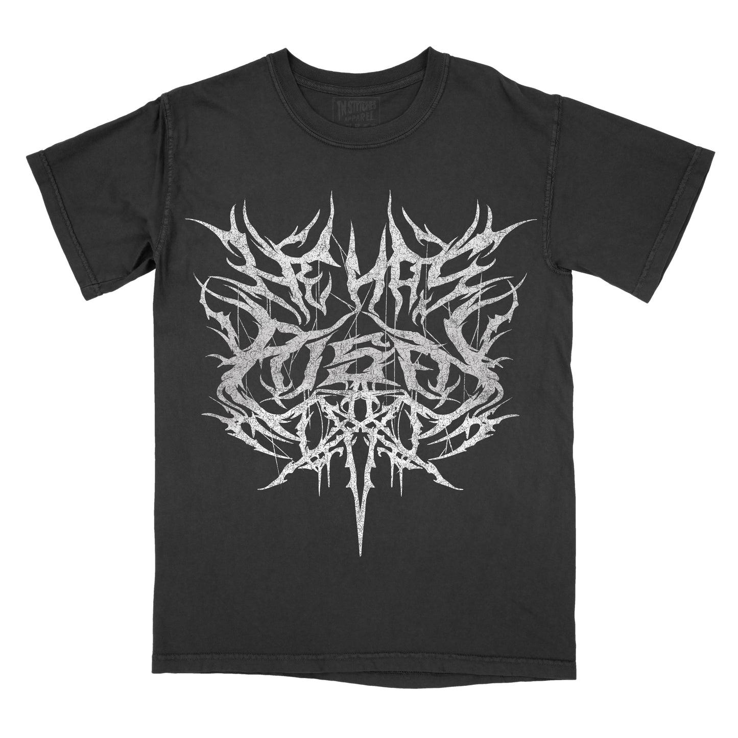 Black T-shirt featuring an intricate white symmetrical design in a black metal-inspired style with sharp spikes, branching lines, and a cross-like shape forming the phrase "He Has Risen."