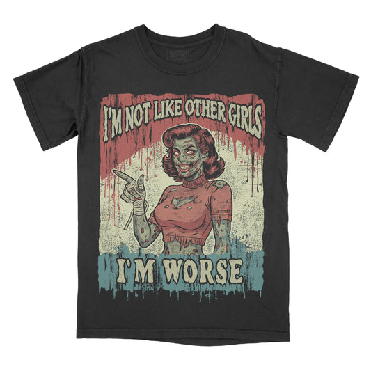 Black vintage-washed graphic tee featuring the phrase "I'm Not Like Other Girls, I'm Worse" with an original zombie pin-up girl illustration, retro horror artwork, distressed graphics, and gothic aesthetic.