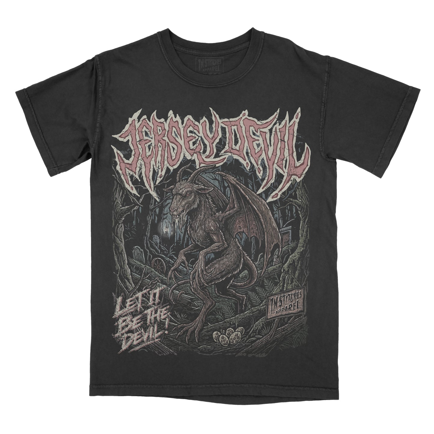 A black short-sleeve graphic t-shirt featuring the Jersey Devil. The front has a large graphic print of a devil creature in a dark forest, with the name 'JERSEY DEVIL' in a stylized font across the chest and the text 'LET IT BE THE DEVIL' on the lower left.