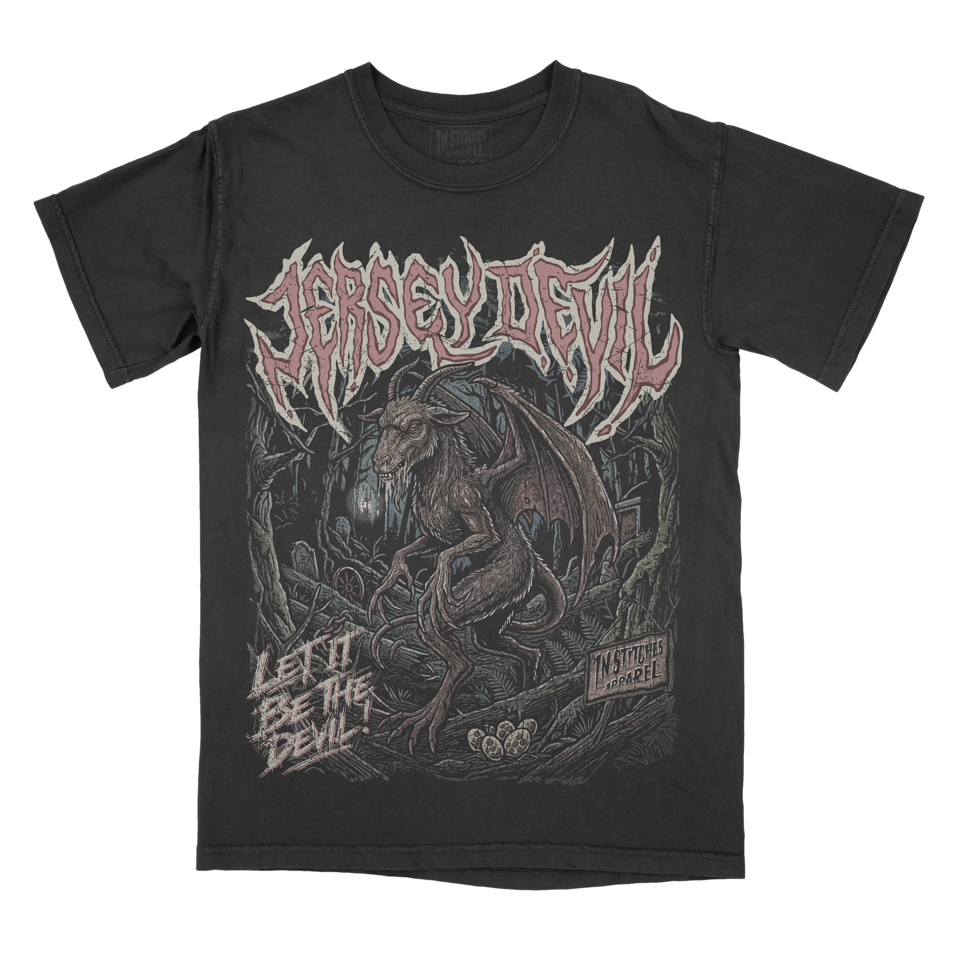 A black short-sleeve graphic t-shirt featuring the Jersey Devil. The front has a large graphic print of a devil creature in a dark forest, with the name 'JERSEY DEVIL' in a stylized font across the chest and the text 'LET IT BE THE DEVIL' on the lower left.