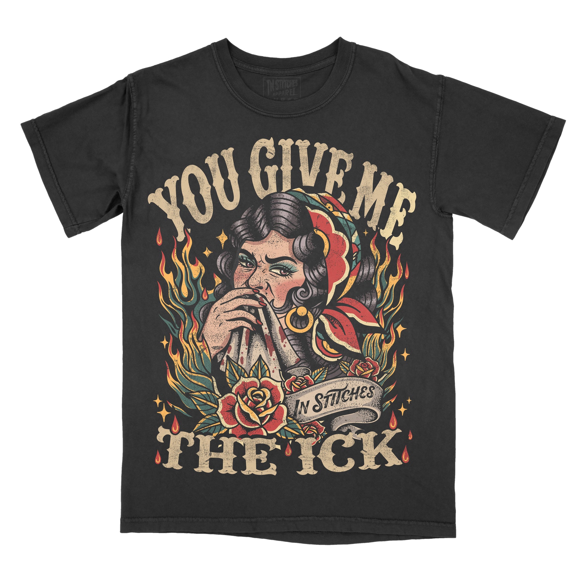 Black Comfort Colors graphic T-shirt featuring a vintage tattoo-style illustration of a woman biting a handkerchief with roses, flames, and the phrase "You Give Me the Ick" in distressed lettering.