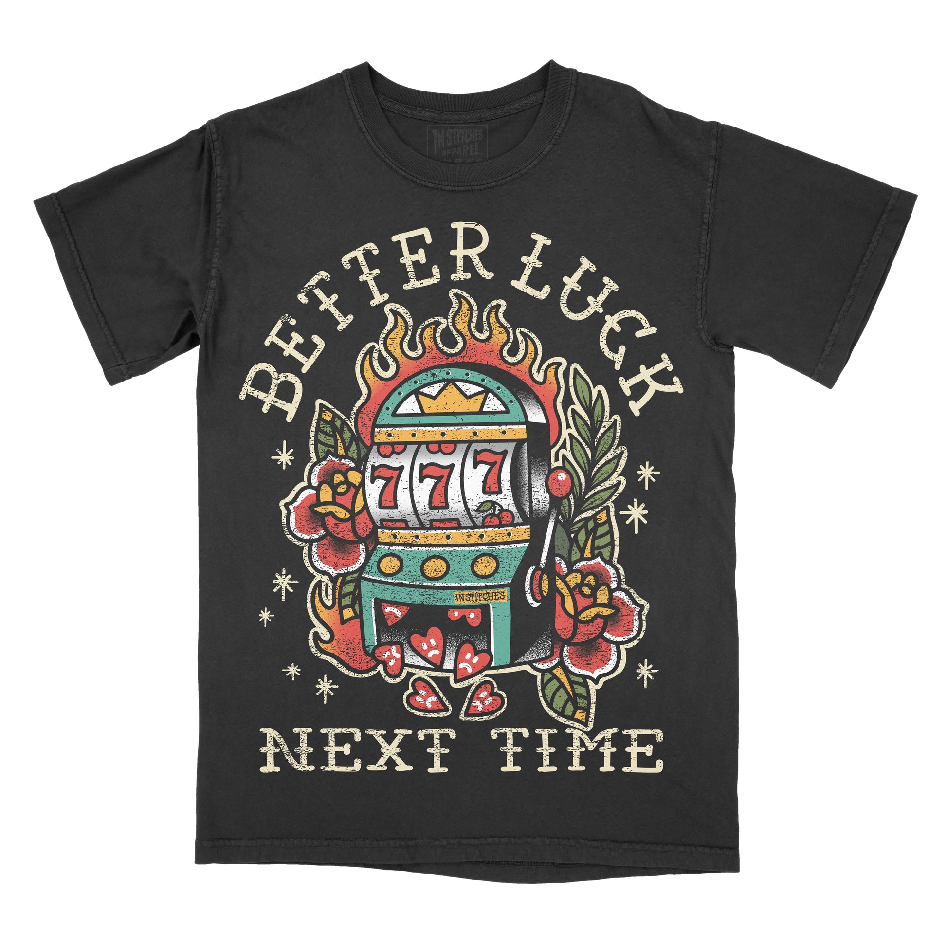 A black short-sleeve t-shirt with a vintage-style tattoo-style graphic of a slot machine, roses, and the text 'BETTER LUCK NEXT TIME' on the front, shown against a plain white background.