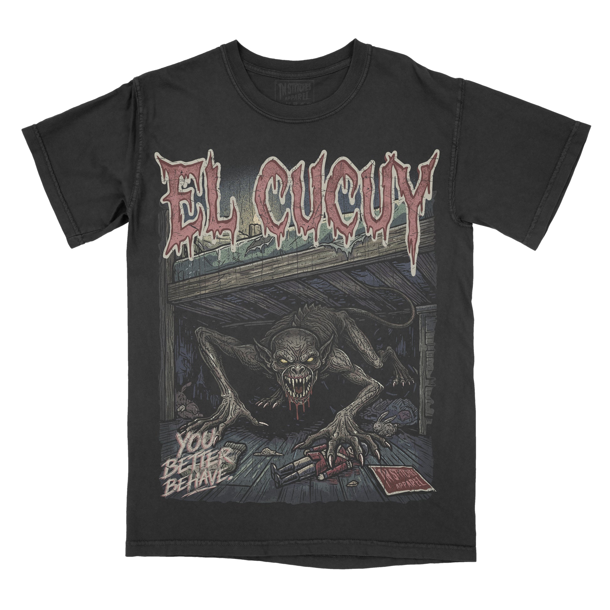 A black short-sleeve graphic t-shirt featuring the El Cucuy with a large horror illustration of a creature in a dark room and the text 'YOU BETTER BEHAVE'.