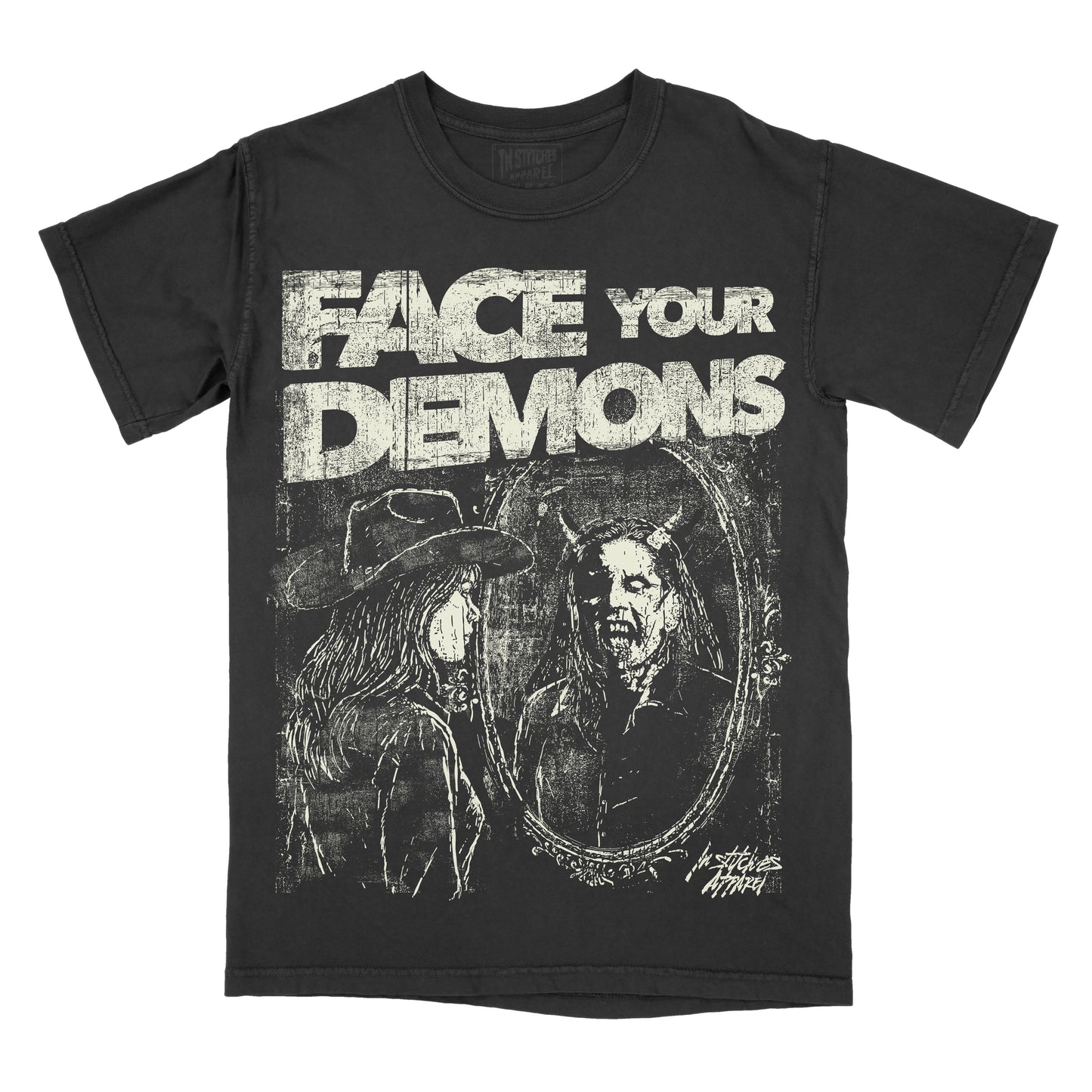 A black short-sleeve graphic t-shirt featuring the distressed white text 'FACE YOUR DEMONS' above a dark illustration of a horned figure in an oval mirror reflection, shown on a plain white background.