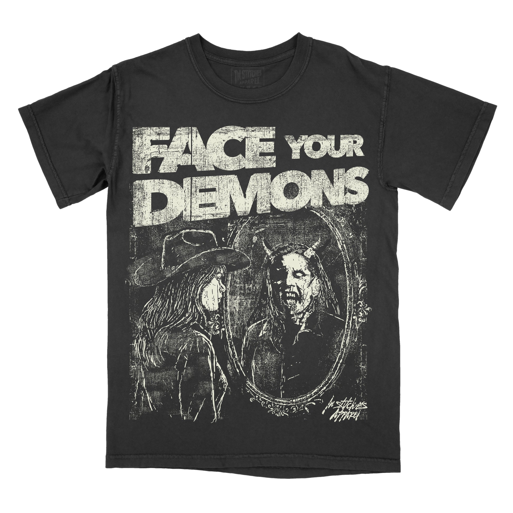 A black short-sleeve graphic t-shirt featuring the distressed white text 'FACE YOUR DEMONS' above a dark illustration of a horned figure in an oval mirror reflection, shown on a plain white background.