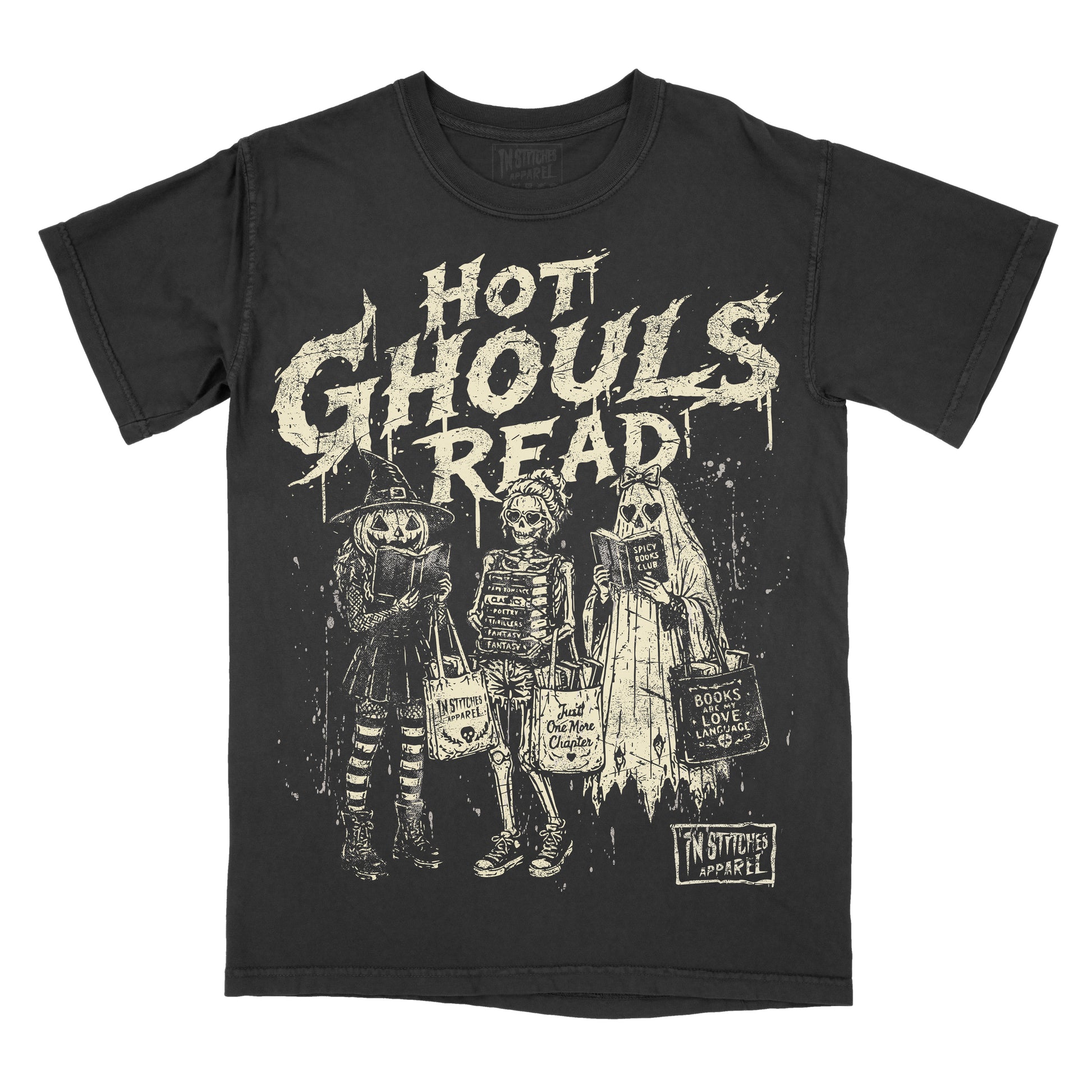 A black short-sleeve graphic t-shirt featuring the distressed white text 'HOT GHOULS READ' above three skeleton characters in Halloween costumes holding bags, with a 'In Stitches Apparel' logo in the bottom right corner.