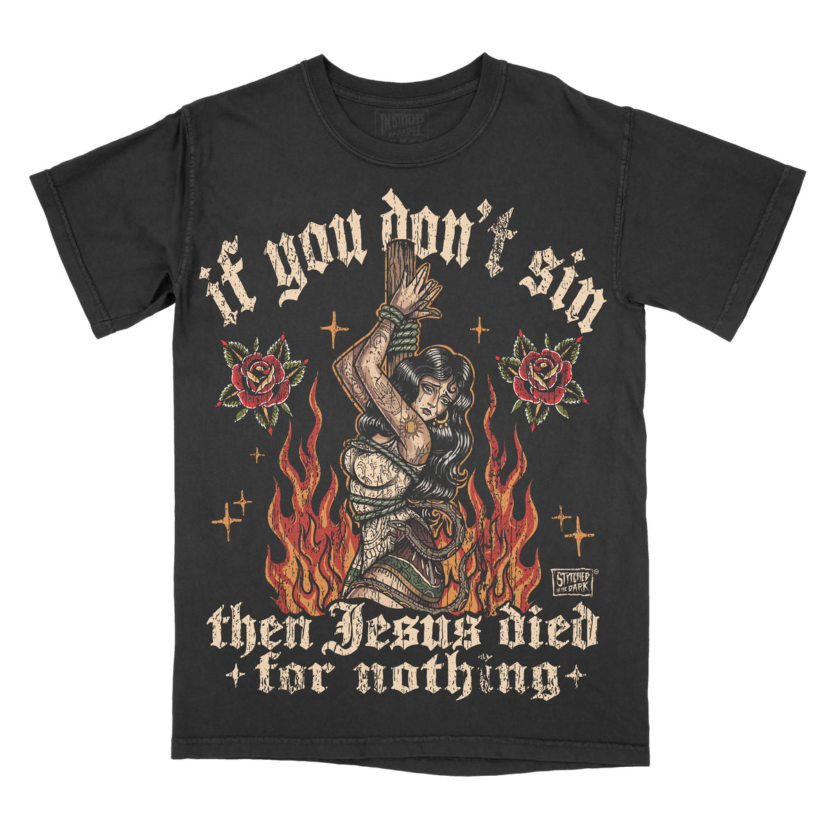 black T-shirt featuring a tattoo-style woman tied to a stake surrounded by flames and red roses, with distressed text reading “If you don’t sin then Jesus died for nothing” and Stitched in the Dark branding.