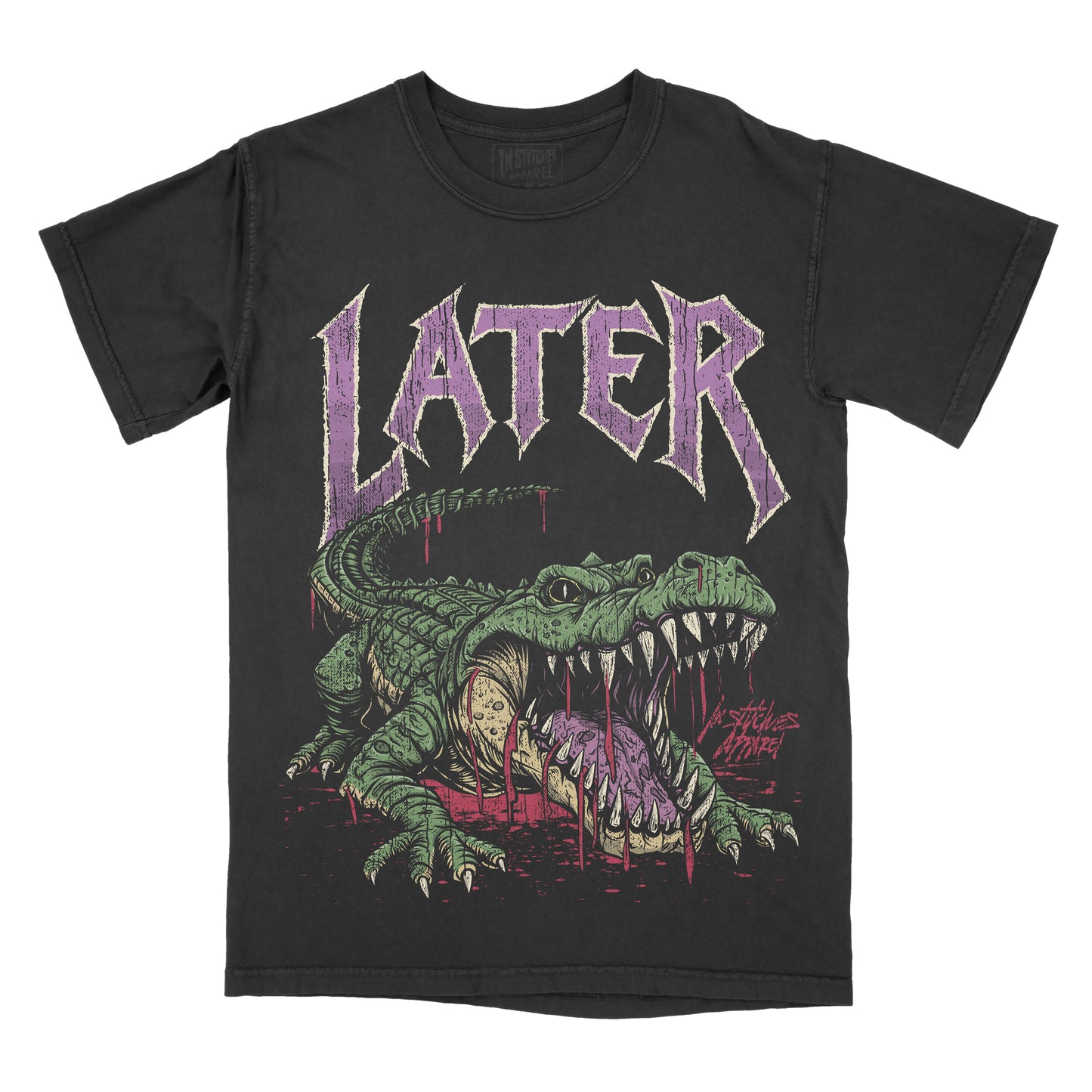 A black short-sleeve graphic t-shirt featuring a green alligator illustration with its mouth open, dripping with purple liquid, beneath the word 'LATER' in a stylized purple font.