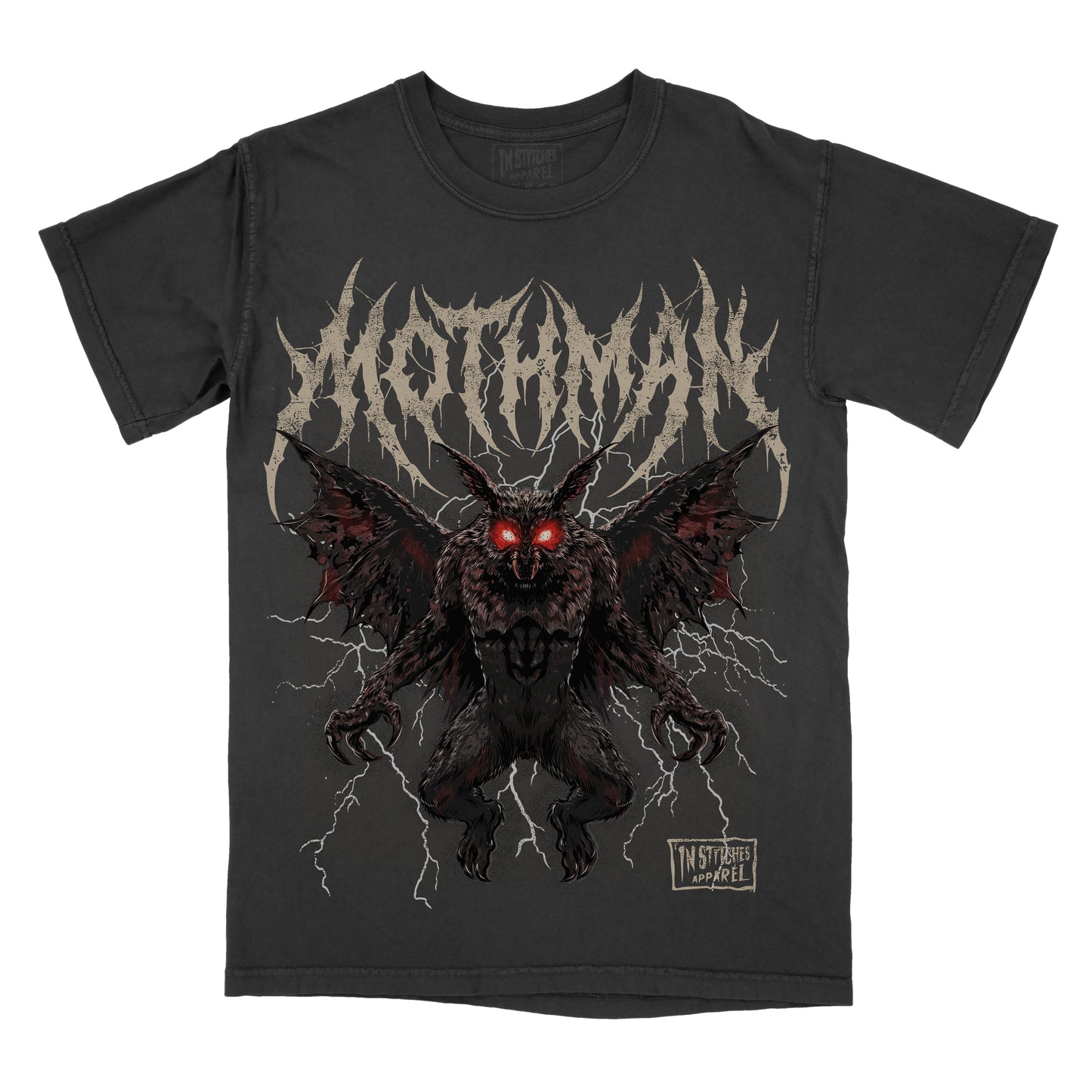 A black short-sleeve graphic t-shirt featuring the name 'Mothman' in a jagged off-white font above a detailed illustration of a dark, winged creature with glowing red eyes and lightning effects. A small 'In Stitches Apparel' logo is visible on the bottom right of the graphic.