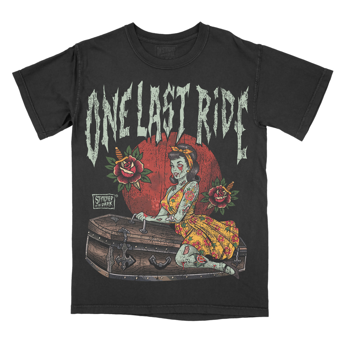 black T-shirt featuring a tattoo-style zombie pin-up woman sitting on a coffin, surrounded by roses and knives, with distressed text reading “One Last Ride” and Stitched in the Dark branding.