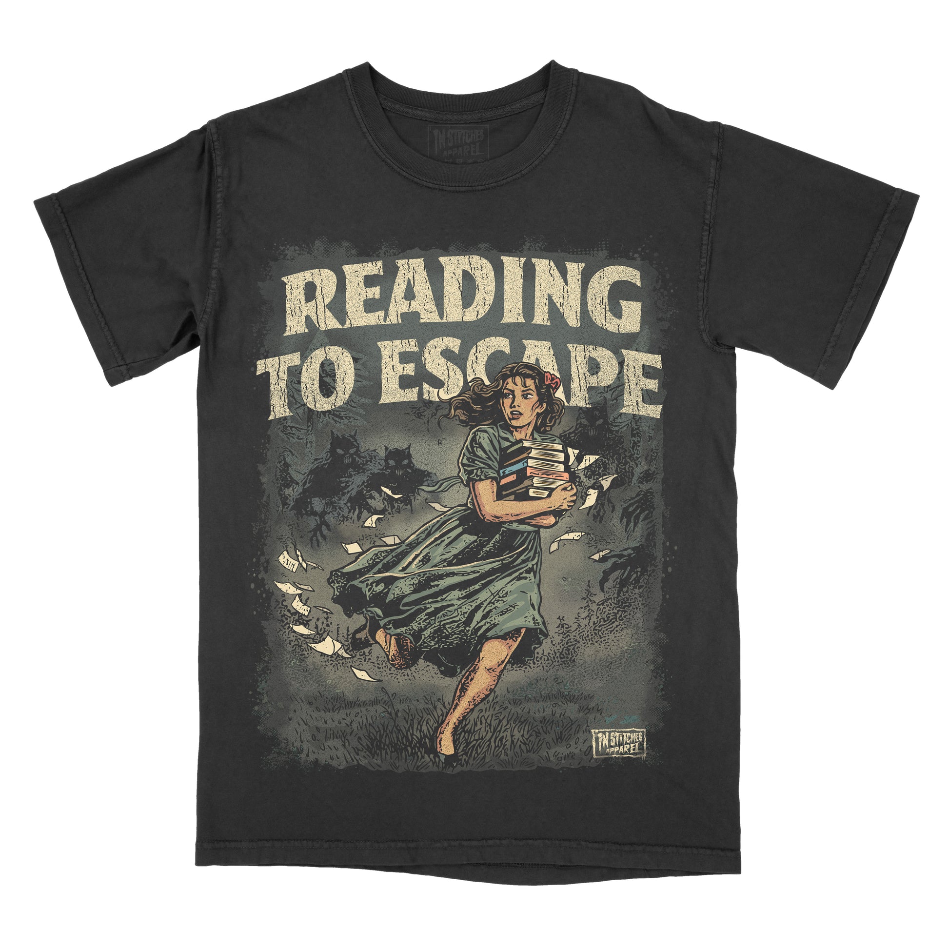 Black garment-dyed graphic t-shirt featuring the phrase "Reading to Escape" with an original vintage-inspired illustration of a woman carrying books while fleeing shadowy monsters through a dark forest.