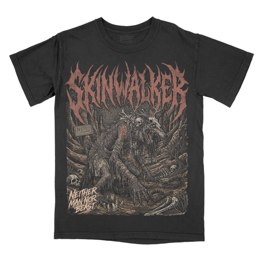 Black graphic t-shirt featuring an original illustration of a skeletal Skinwalker creature with gothic lettering and dark forest-inspired artwork.