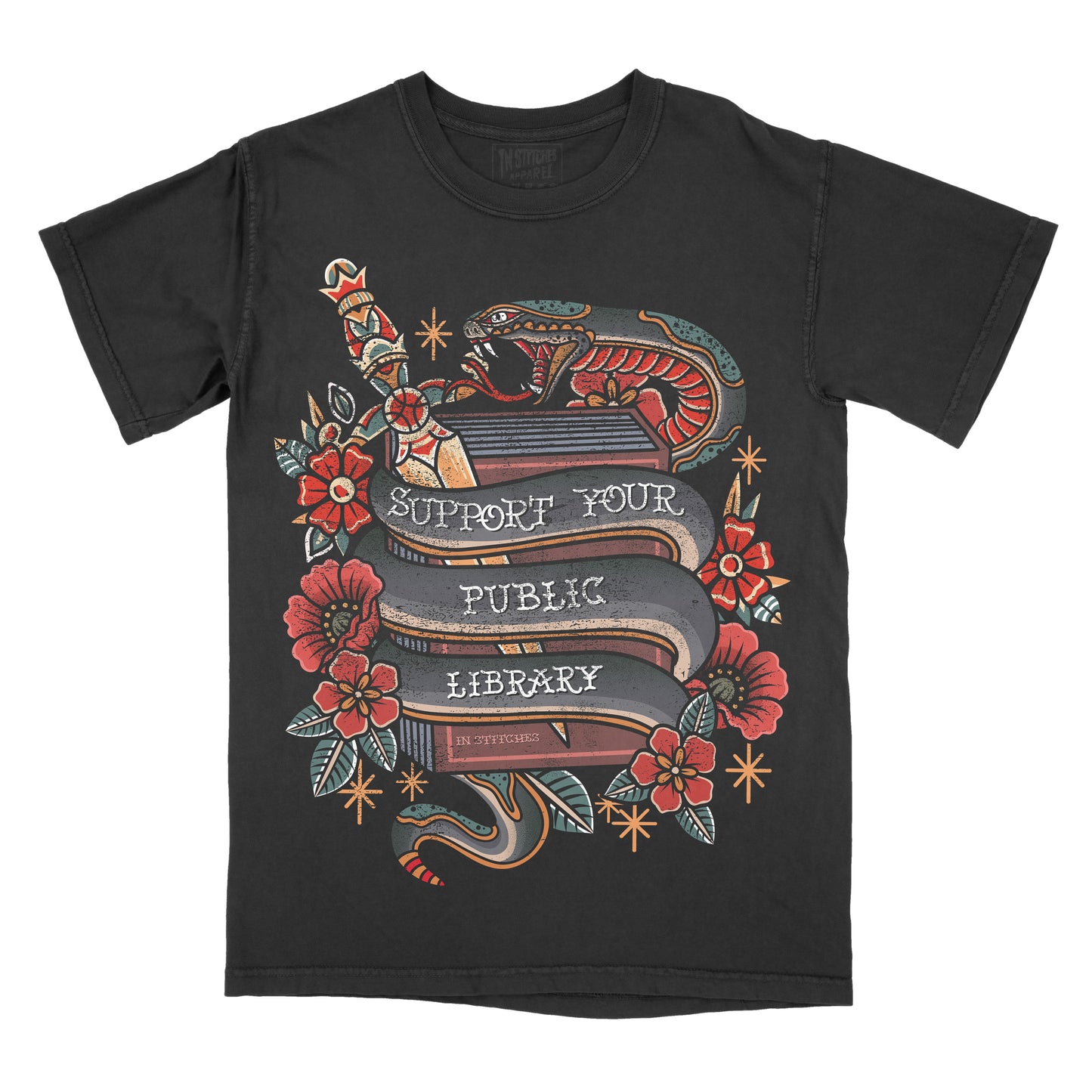 A black short-sleeve crewneck t-shirt featuring a detailed graphic print on the front. The graphic depicts a traditional tattoo-style design with a snake wrapped around a book, red flowers, and banners reading 'SUPPORT YOUR PUBLIC LIBRARY' 