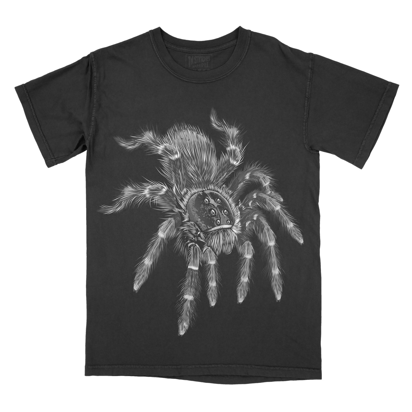 Black vintage-washed graphic t-shirt featuring a detailed black-and-white illustration of a realistic hairy tarantula, creating a bold gothic, spooky, and nature-inspired design.