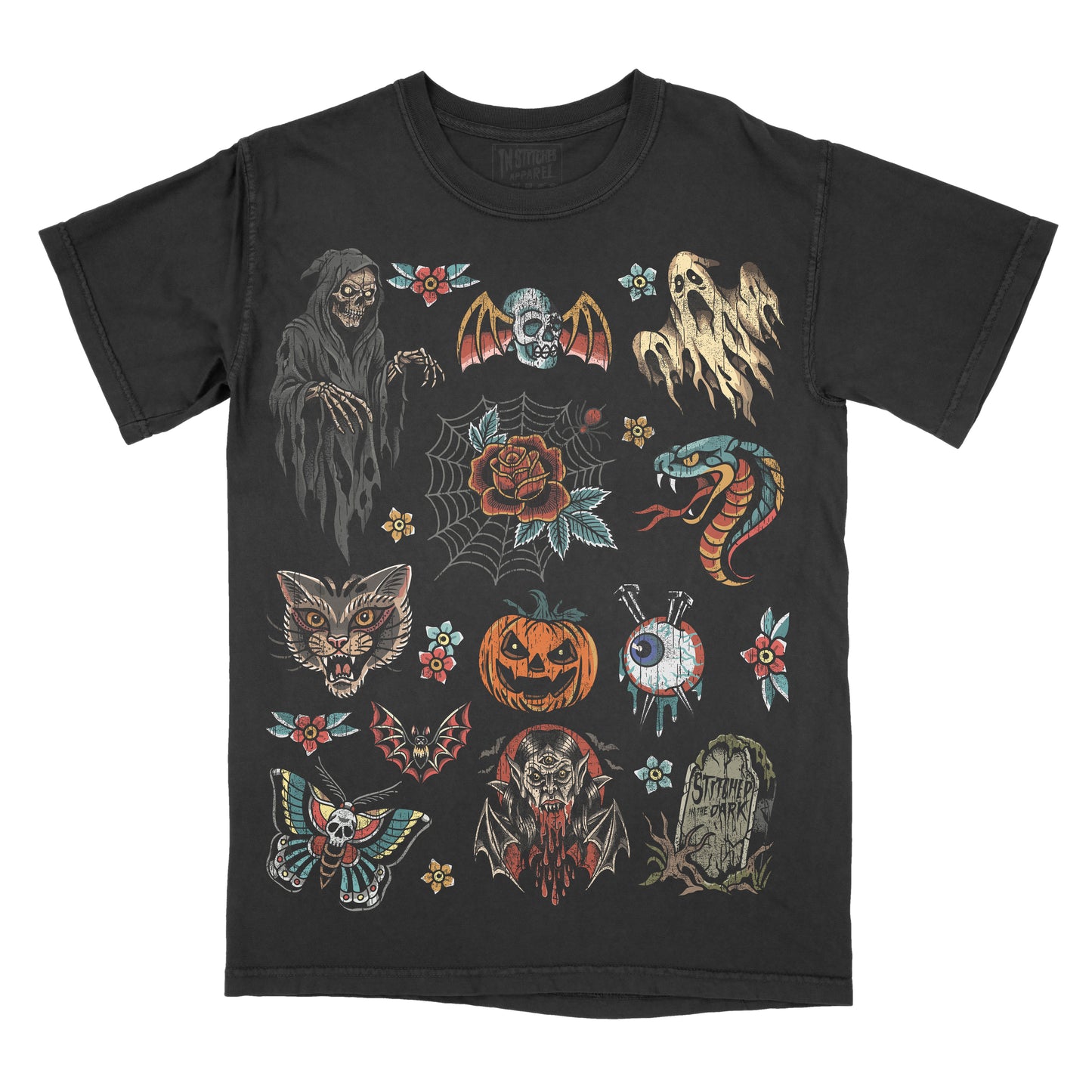 black graphic T-shirt featuring colorful traditional tattoo flash artwork with a grim reaper, ghosts, bats, snake, black cat, jack-o’-lantern, eyeball, vampire, moth, roses, spiderwebs, and Stitched in the Dark tombstone.
