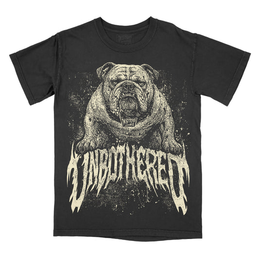 A black short-sleeve graphic t-shirt featuring a detailed illustration of a bulldog above the stylized text 'UNBOTHERED' in a distressed cream color, shown against a plain white background.