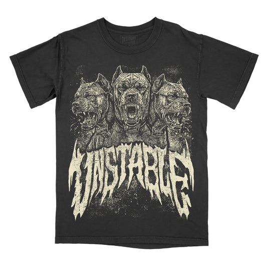 A black short-sleeve graphic t-shirt featuring three snarling dogs in a distressed cream print above the word 'unstable' in a jagged, heavy metal font.