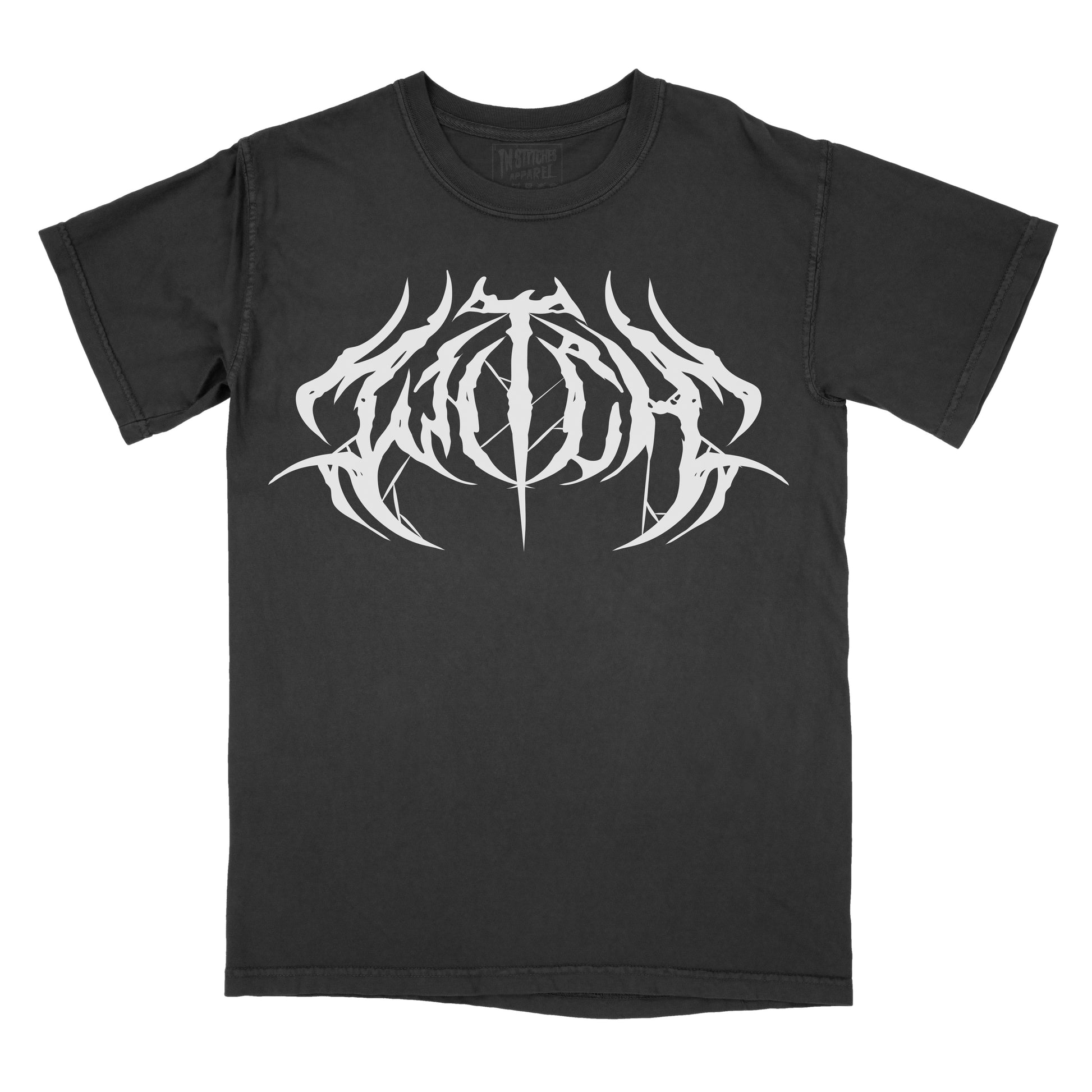 Black T-shirt featuring the word "WITCH" in a white heavy metal-inspired font with mirrored, jagged lettering, pointed spikes, and subtle spiderweb details.